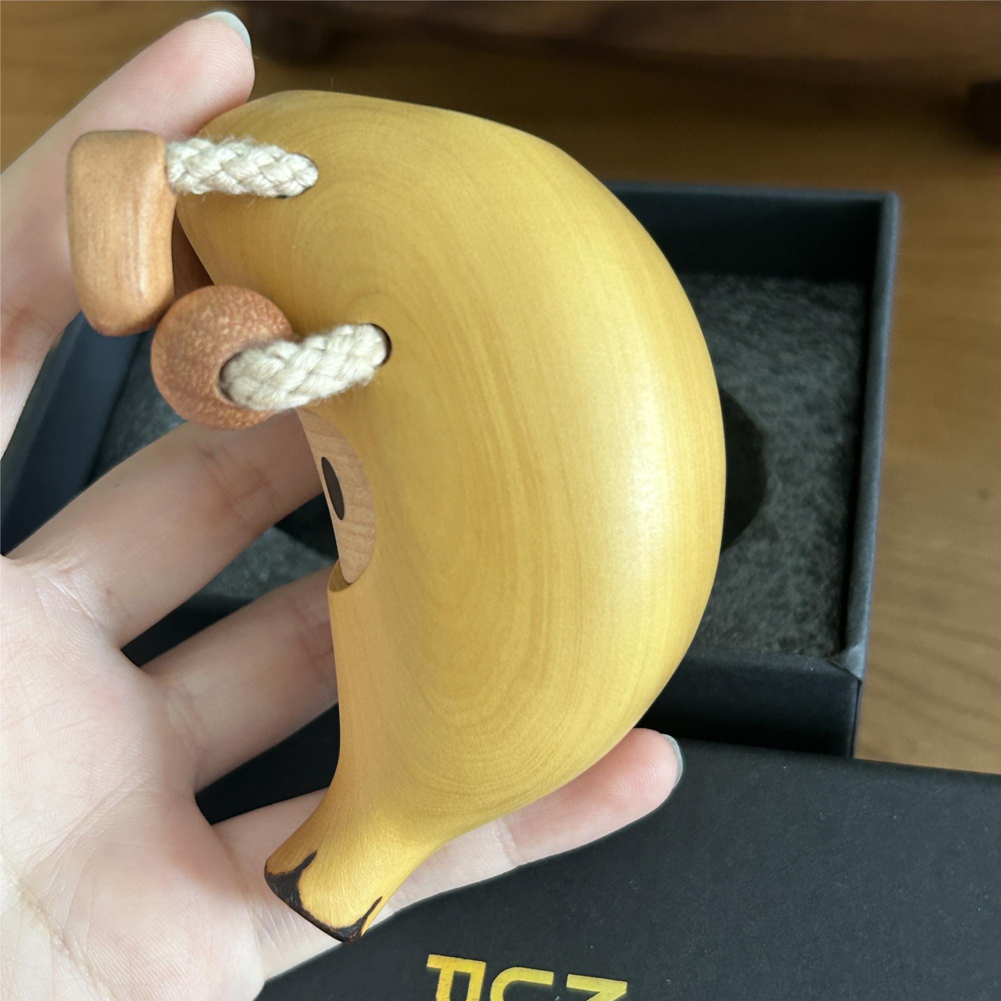 Handmade wooden banana man, a unique gift idea for an anniversary.