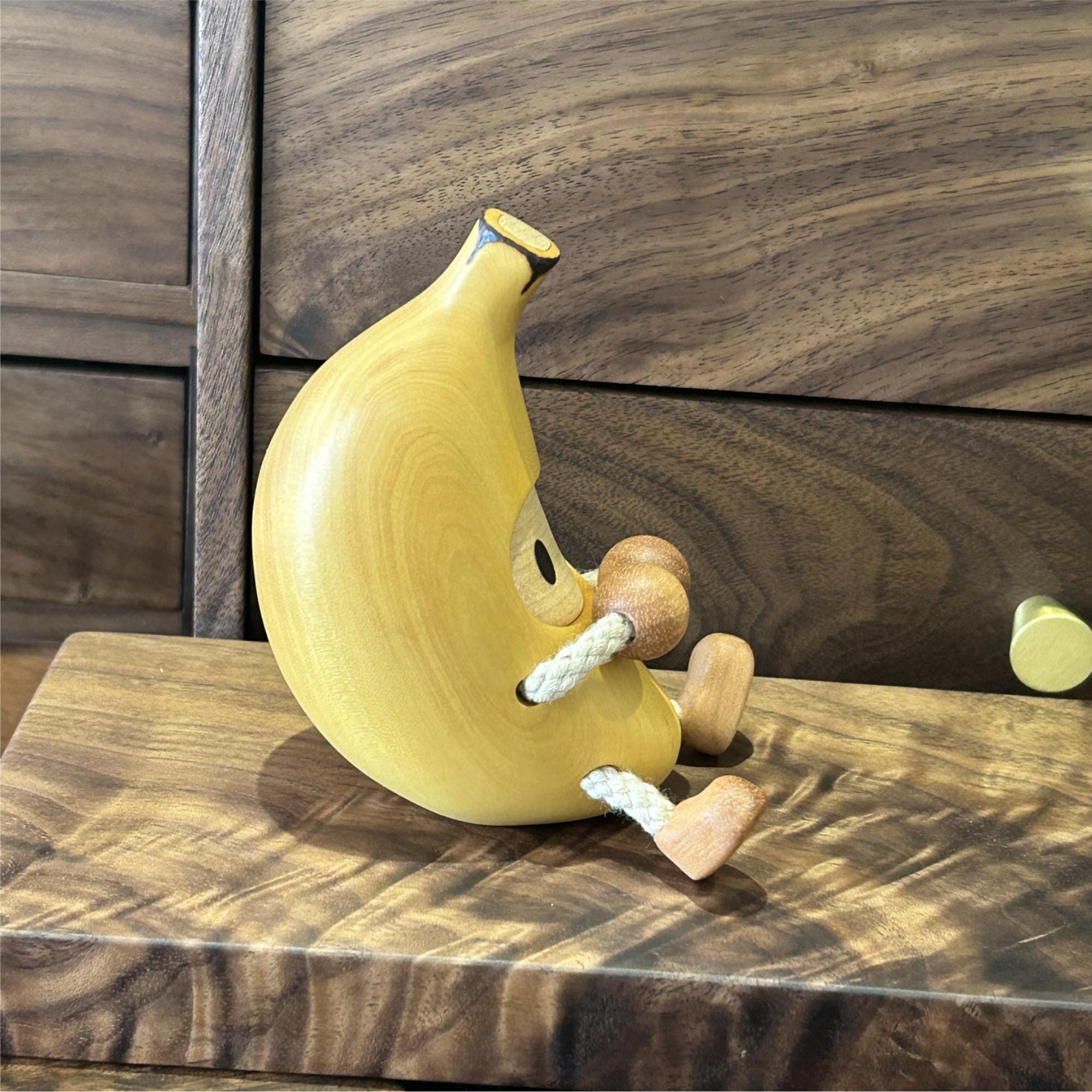 Handmade wooden banana man, a unique gift idea for an anniversary.